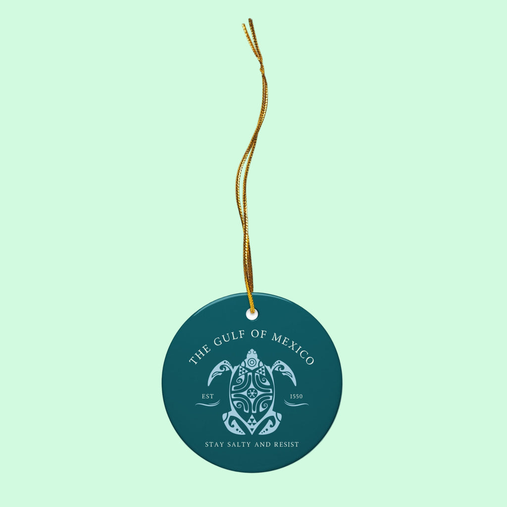 Round teal tag with turtle design and text on a white background